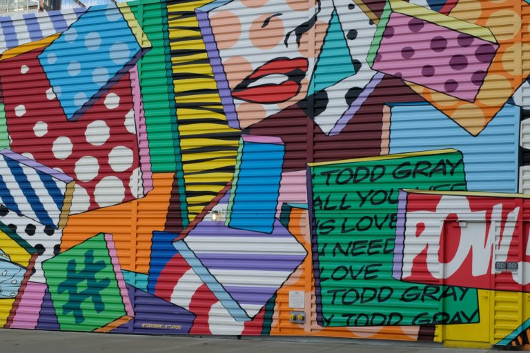 A mural on a wall of a colourful art feature.